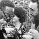 Cuban Prime Minister Fidel Castro, right, shows Angolan Movimento Popular de Liberta��o de Angola (MPLA) President Agostinho Neto how to drink a daikiri, a frozen Cuban drink made with rum, ice and sugar, during a reception in his honor in Havana, July 28, 1976.